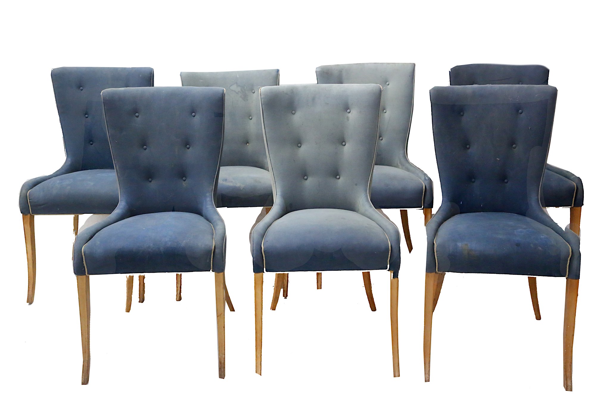A set of seven dining chairs, mid-20th century, upholstered in buttoned pale blue velvet, on maple