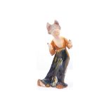 A Chinese Tang style glazed pottery figure of a dancing lady, 29cm high