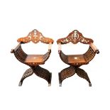 A near pair of Italian walnut Savonarola chairs, late 19th century, the folding X frames bone and