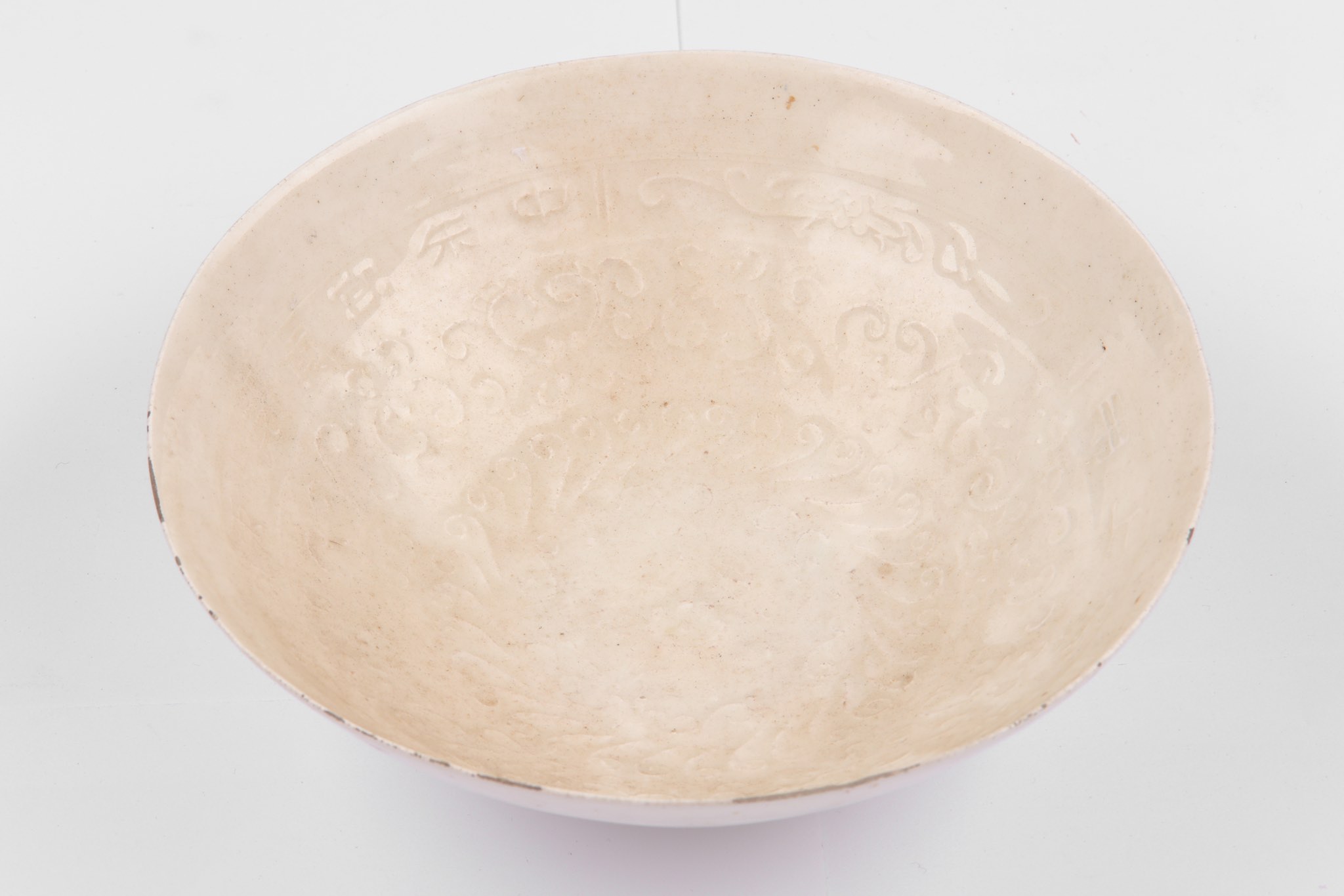 A Chinese white glazed moulded bowl, Song dynasty