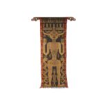 An East Sumba ancestor banner, circa 1950, and a Maori reed skirt, circa early 20th century, the