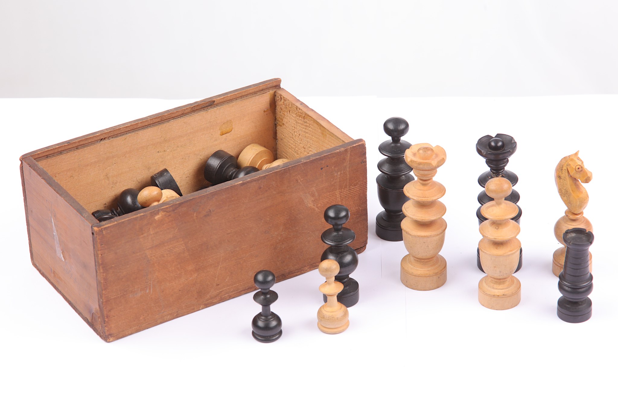 A boxwood and stained ebony chess set, early 20th