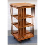 A late Victorian light oak revolving bookcase, with three tiers, 115 cm high