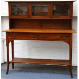 An Art Nouveau mahogany sideboard, with raised superstructure and three glazed doors, the main