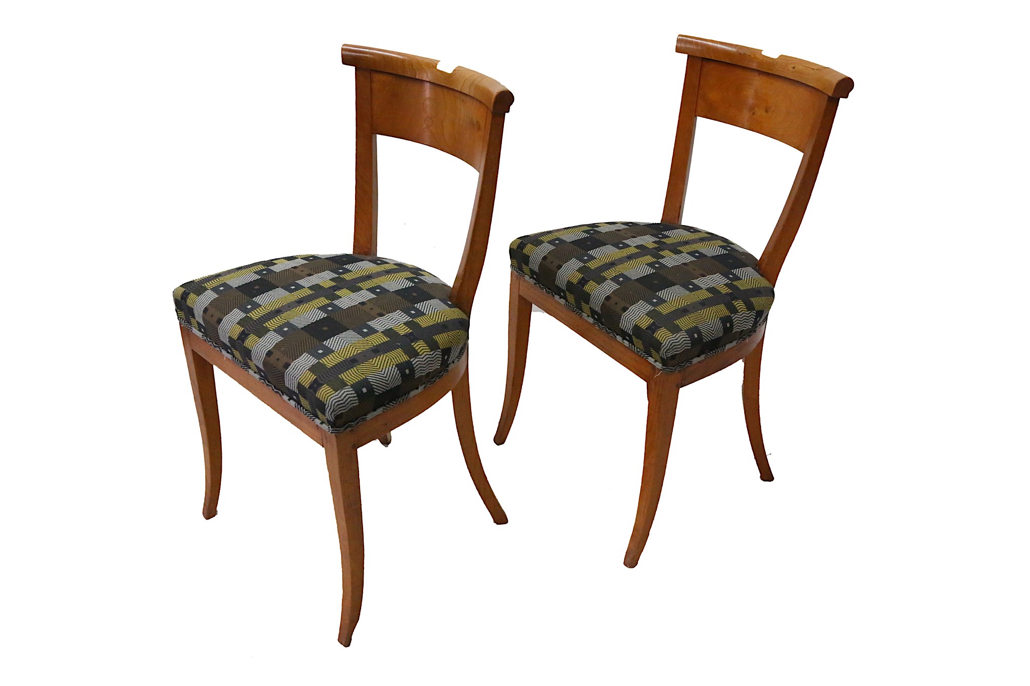 A pair of Biedermeier style elm side chairs, 20th century, with curved backs on sabre legs (2)