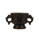 A CHINESE BRONZE INCENSE BURNER, GUI. Qing Dynasty. Of archaistic gui form, cast with a taotie mask