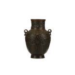 A CHINESE BRONZE VASE, HU. Qing Dynasty. Rising to