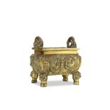 A CHINESE BRONZE ‘DRAGONS’ INCENSE BURNER. Qing Dynasty. Of rectangular section with rounded sides,