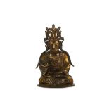 A CHINESE GILT BRONZE FIGURE OF GUANYIN. Ming Dynasty, 17th Century. Seated in dhyanasana, dressed