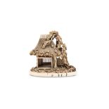 AN IVORY AND BONE OKIMONO OF A HOUSE. 19th/20th Century. Formed as a well modeled thatched hut