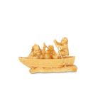 AN IVORY NETSUKE OF SHOKI AND ONI. 19th Century. The demon queller seated on the edge of a boat