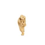 AN IVORY NETSUKE OF AN IMMORTAL WITH A GOURD. 19th Century. The immortal standing and looking up,