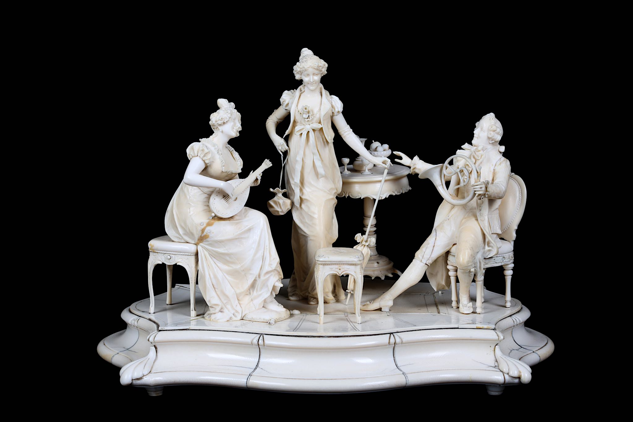 A LARGE LATE 19TH CENTURY GERMAN / AUSTRIAN CARVED IVORY FIGURAL GROUP OF AN INTERIOR SCENE