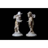 AN UNUSUAL PAIR OF 19TH CENTURY FRENCH (DIEPPE)  IVORY FIGURES OF PUTTI IN NAPOLEONIC DRESS 'THE