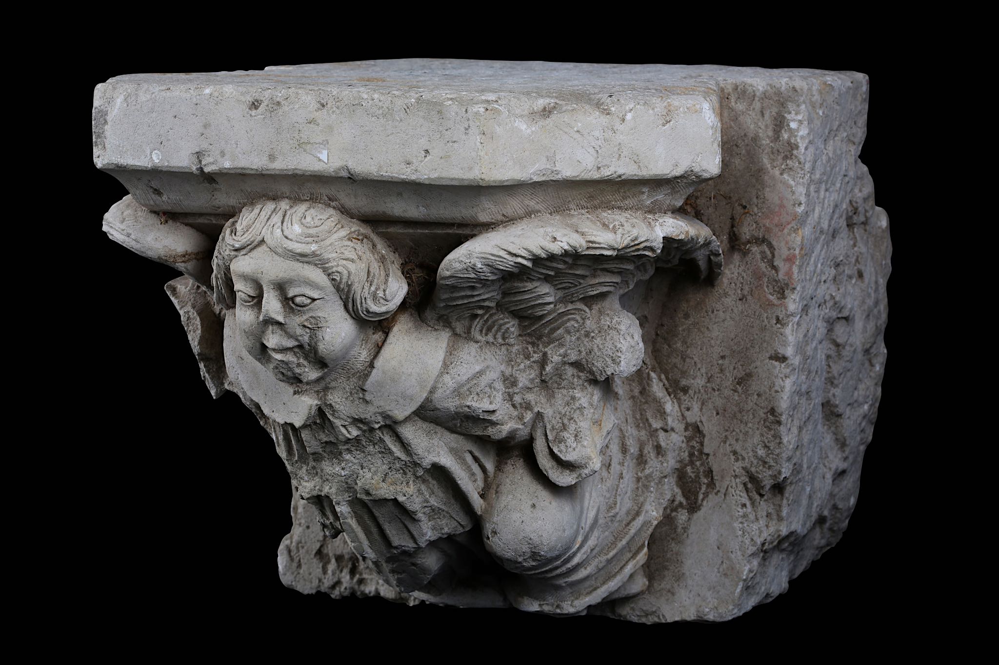 A FRENCH GOTHIC STYLE CARVED LIMESTONE CORBEL DEPICTING AN ANGEL POSSIBLY 16TH CENTURY the figure