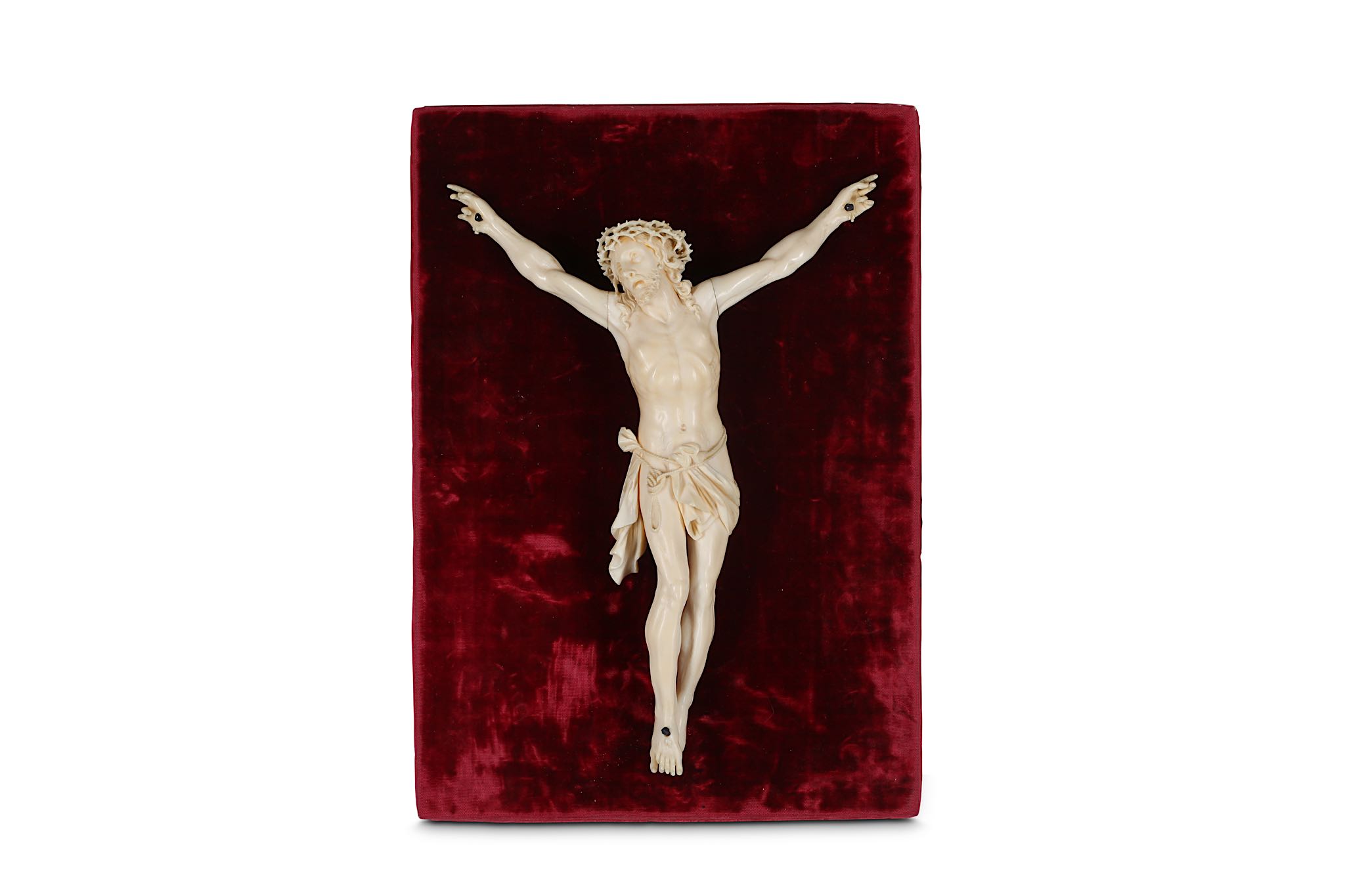 A 19TH CENTURY CARVED IVORY CORPUS CHRISTI the crucifix figure of Christ depicted wearing the