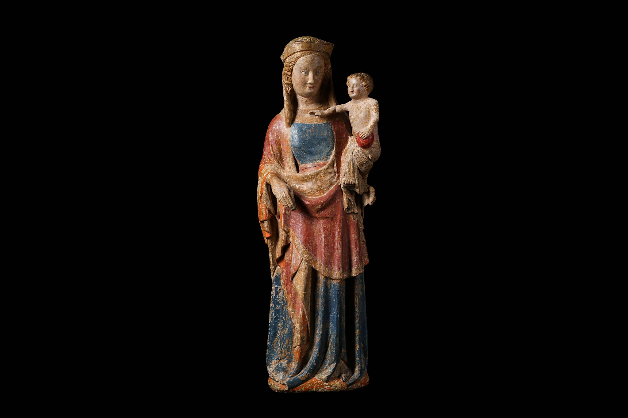 A MID 14TH CENTURY FRENCH POLYCHROME, GILDED AND CARVED LIMESTONE GROUP OF THE VIRGIN AND CHILD,