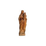 A 19TH CENTURY NORTH EUROPEAN CARVED BOXWOOD VIRGIN AND CHILD carved in the round, the Virgin