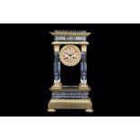 A 19TH CENTURY FRENCH ROCK CRYSTAL STYLE GLASS AND GILT BRONZE PORTICO CLOCK ATTRIBUTED TO