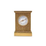 AN EARLY 20TH CENTURY SWISS GILT BRONZE MINIATURE TRAVELLING / CARRIAGE CLOCK RETAILED BY J.W.