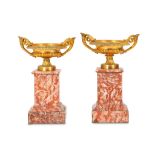 A PAIR OF LATE 19TH CENTURY FRENCH GILT BRONZE AND COLOURED MARBLE TAZZAS the squat urns with