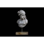 A MID 18TH CENTURY GERMAN CARVED ALABASTER BUST OF A CHILD looking to sinister, a floral sprig in