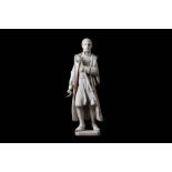 A 19TH CENTURY IVORY FIGURE OF A NAPOLEONIC OFFICER the standing figure holding a scroll in one hand