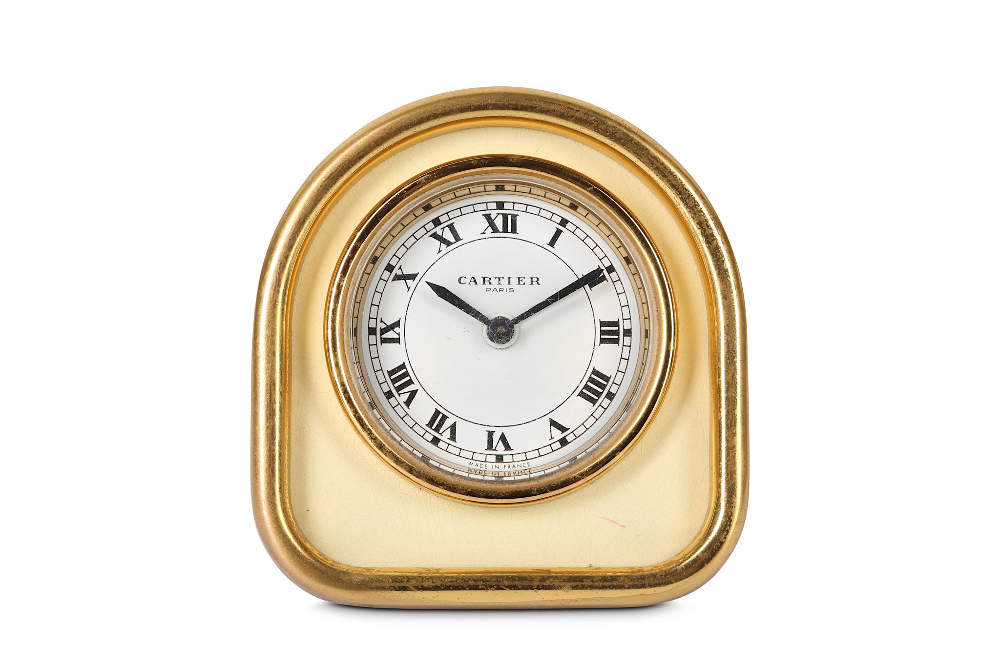 A LATE 20TH CENTURY CARTIER GILT BRASS ALARM CLOCK of arched frame form with cream enamel