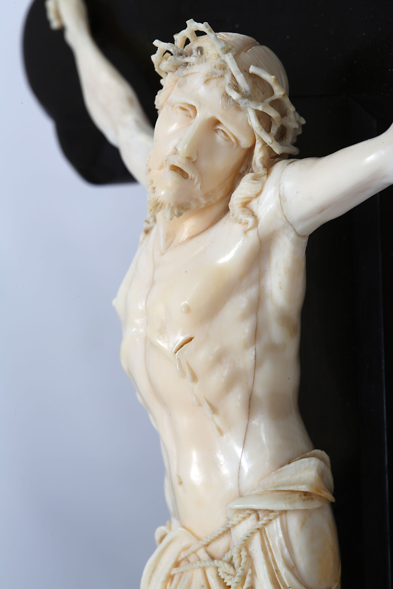 A 19TH CENTURY CARVED IVORY AND EBONY CRUCIFIX  the Corpus Christi figure of Christ depicted wearing - Image 5 of 5