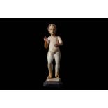 AN 18TH CENTURY SPANISH CARVED IVORY AND PARCEL GILT FIGURE OF THE INFANT CHRIST IN BLESSING  the