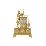 AN EARLY 19TH CENTURY FRENCH EMPIRE PERIOD GILT BRONZE CLOCK DEPICTING APOLLO the standing figure