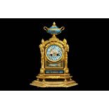 A LATE 19TH CENTURY FRENCH GILT BRONZE AND PORCELAIN MOUNTED MANTEL CLOCK the case of arched form