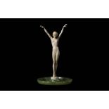 A FRENCH ART DECO PERIOD CARVED IVORY FIGURE OF A NUDE GIRL CIRCA 1920 the standing figure with both