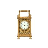 A LATE 19TH CENTURY FRENCH GILT BRASS CARRIAGE CLOCK the ornate case with ring and knopped finials