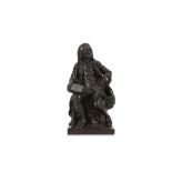 A LATE 18TH / EARLY 19TH CENTURY FRENCH CAST IRON STATUETTE OF VOLTAIRE  depicted seated on a rocky