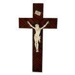 A 19TH CENTURY FRENCH / ITALIAN CARVED IVORY CRUCIFIX ON CALAMANDER VENEERED CROSS the ivory