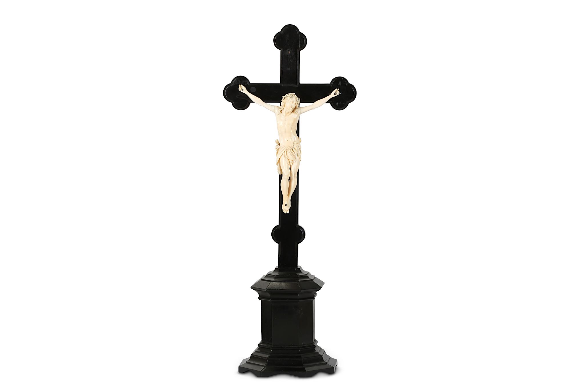 A 19TH CENTURY CARVED IVORY AND EBONY CRUCIFIX  the Corpus Christi figure of Christ depicted wearing