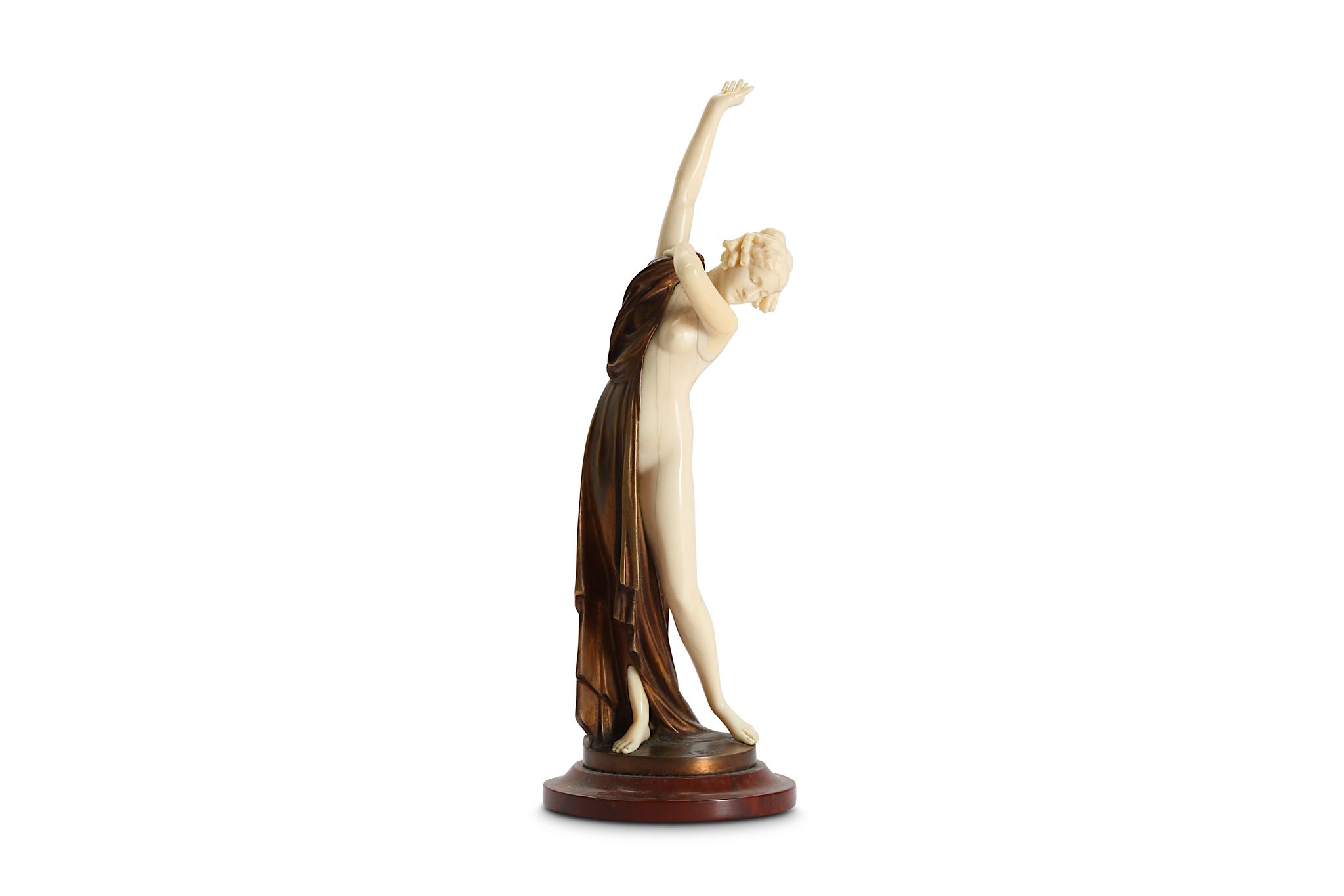 ERNST SEGER (GERMAN: 1868-1939): A CARVED IVORY AND BRONZE FIGURE OF A GIRL 'AFTER THE BATH' the