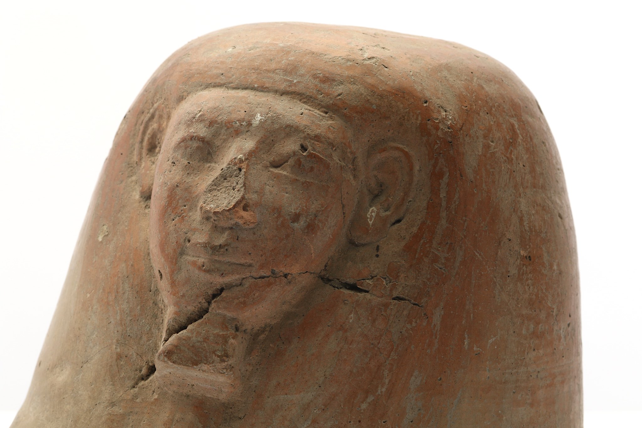 A TERRACOTTA CANOPIC JAR LID New Kingdom, Circa 1550 - 1070 B.C. Of human-headed Imsety, the - Image 4 of 6