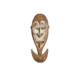 A MIDDLE SEPIK DOUBLE HOOK, PAPUA NEW GUINEA With a large oval shaped face, with a heavy brow, inset