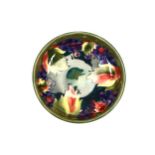 A Moorcroft pottery pedestal bowl, mid-20th Century, tubeline decorated with leaves and fruit in