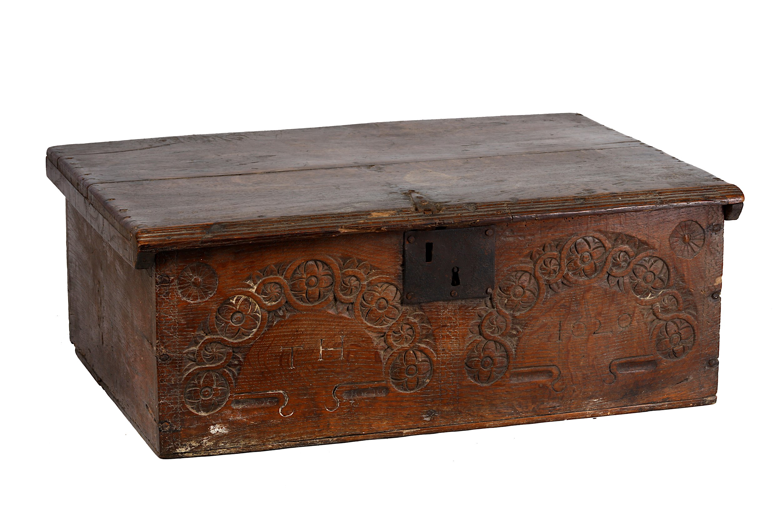 An English oak bible box, 17th Century, the front carved with twin Tudor Rose roundel arches,