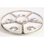 A Herend porcelain supper set, 20th Century, comprising circular dish and seven shaped inserts,