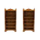 A pair of Sheraton design marquetry inlaid, satinwood and mahogany open bookcases, with shaped