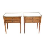 A pair of French gilt metal mounted mahogany bedside chests, the white marble tops with pierced