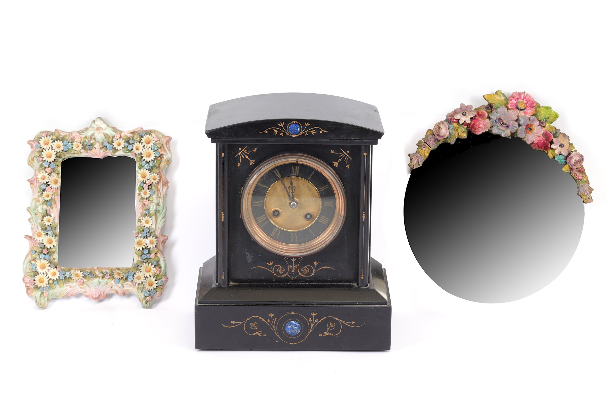 A late Victorian black slate and Lapis Lazuli eight-day mantel clock, a small continental floral