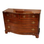 A reproduction George III design mahogany serpentine chest, fitted with four drawers, on bracket