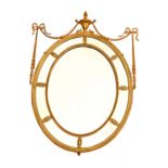 A Victorian Adam design oval giltwood and gesso marginal plate wall mirror, 19th Century, with