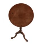 A good George III mahogany tilt-top occasional table, the circular top with 'bird cage' block,