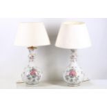 A pair of French porcelain lamps, late 19th Century, possibly Samson, Chinoiserie decorated in